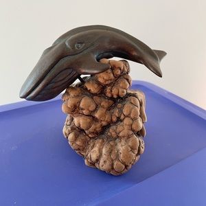 Vintage sculpture of a whale mounted on beautiful wood